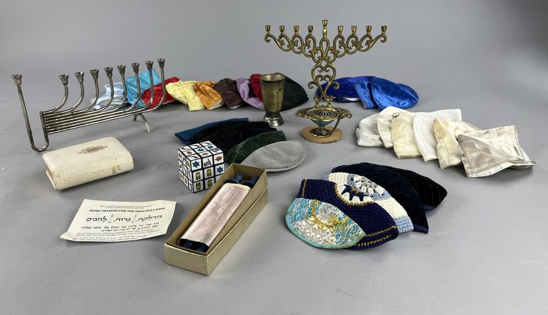 Judaica Menorahs, Yarmulkes, Kiddush Cup & More: Collection of Judaica, include 2 Menorahs, 32 yarmulkes or Kippahs, a Kiddush cup, and more. SHIPPING: In-House Shipping available for this lo