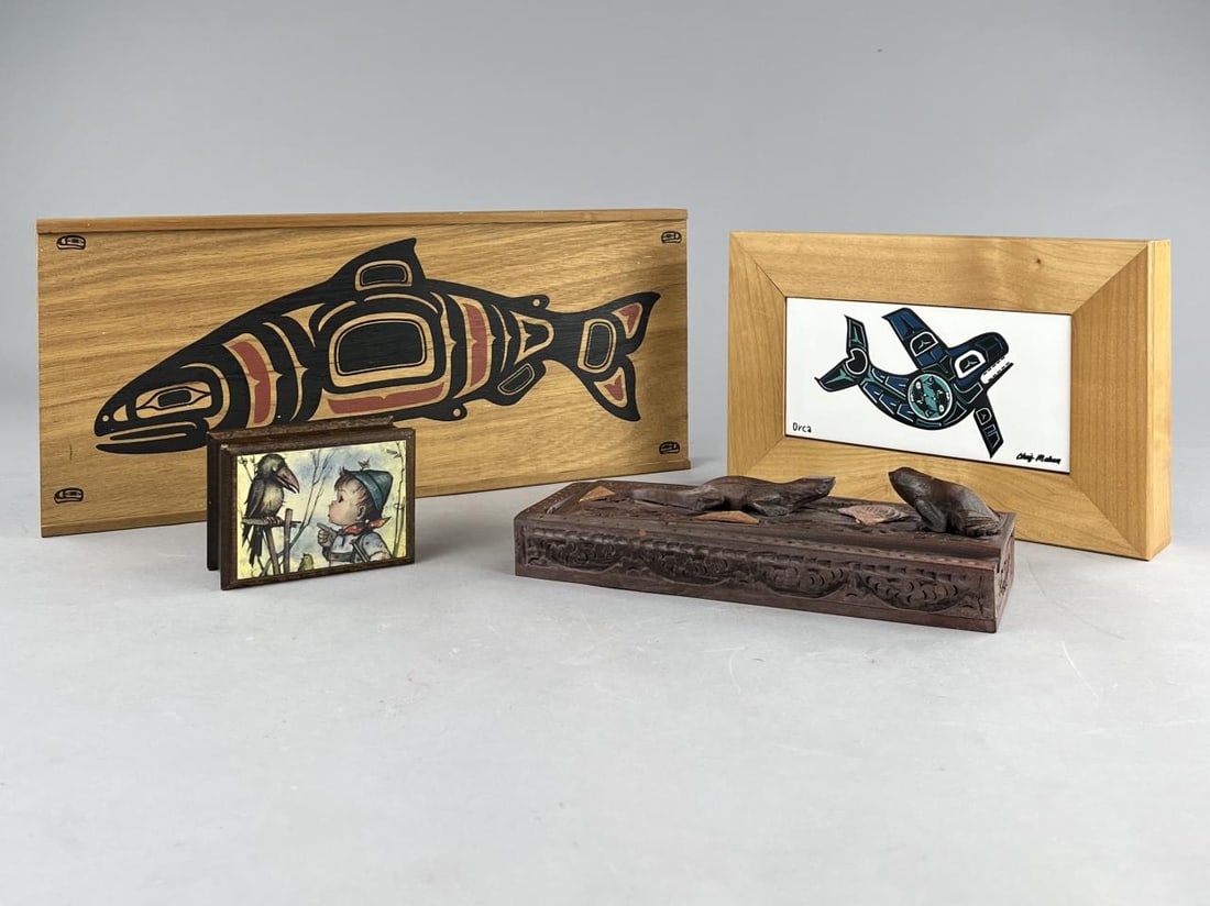 4 Decorative Boxes: Four decorative boxes, Swiss music box, two wood boxes featuring Northwest Native American imagery, and an Indonesian carved chopstick box with a figural frog and lizard on the lid and 4 pairs of carv