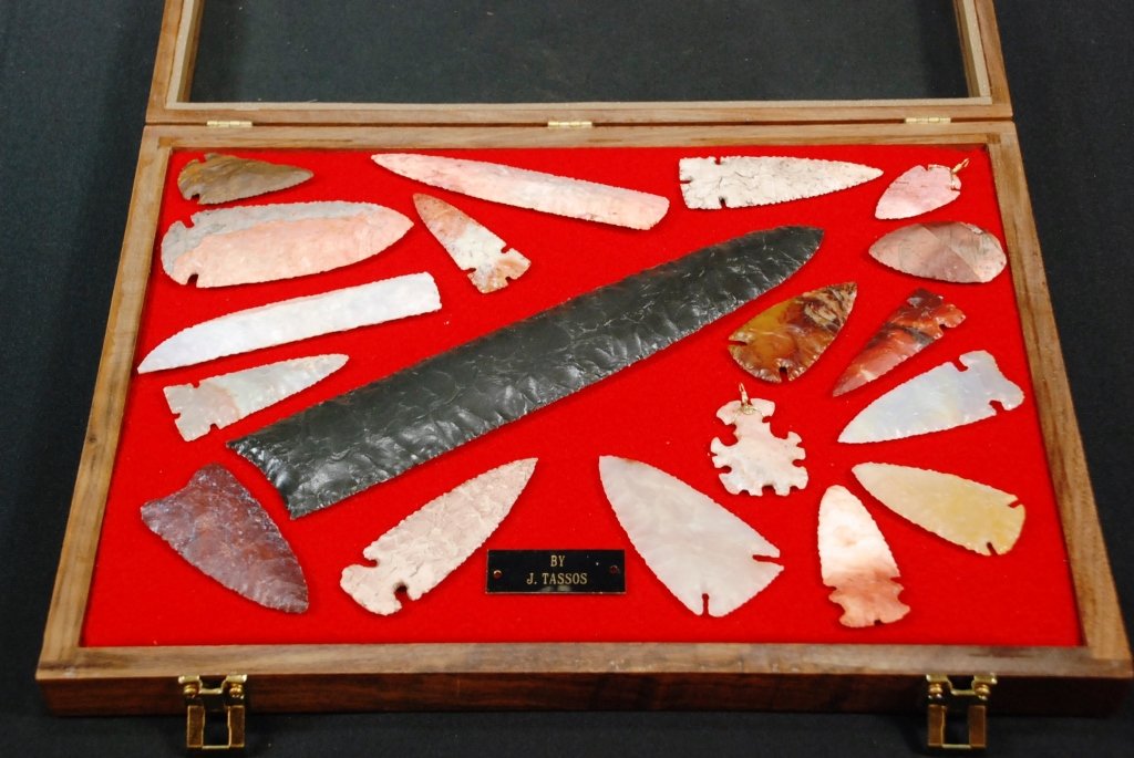 19 J. Tassos Flint Knapped Arrow & Spearheads: 19 pieces total Contemporary Includes knife blade and pendant Longest is 10" Shortest is 1.75"