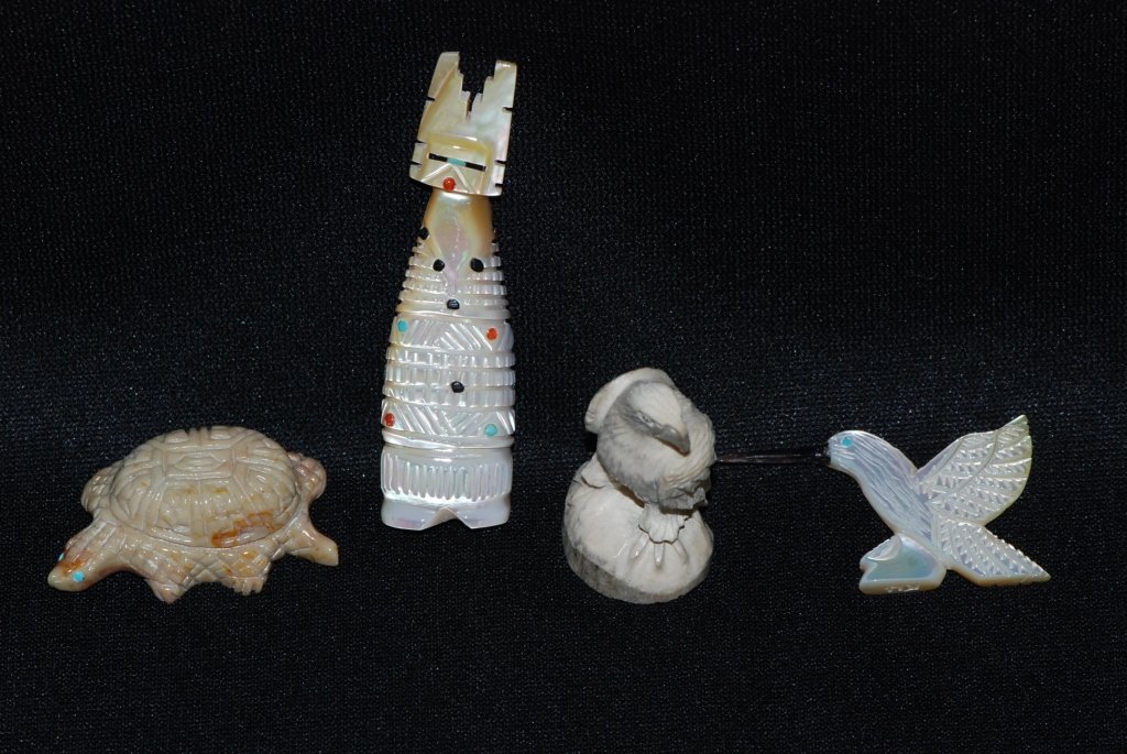 Four Hand Crafted Animal Sculptures: Spirit Of The Lioness Native American Arts Mother of pearl hummingbird by Yancy Robert Halesewa Zuni Antler eagle by Herb Hustito Zuni Mother of Pearl Totum