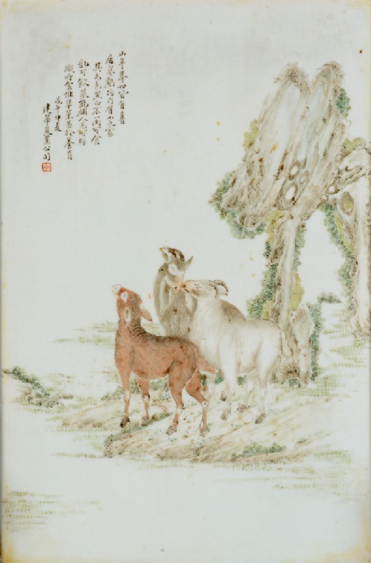 A wooden and porcelain table screen with a decor of: A wooden and porcelain table screen with a decor of goats and a story, which is a symbol of the city Kanton, dated 1978. China, Kanton. Dim. porcelain: 38 x 25 cm. Provenance: bought in Hong Kong, 197