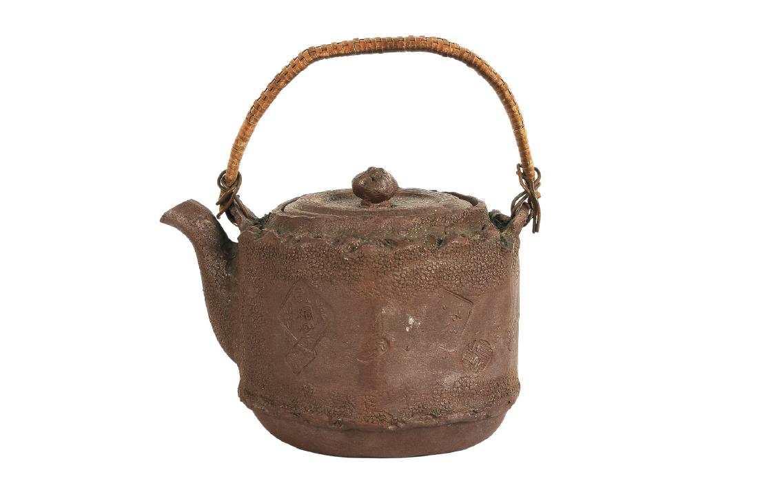 A natural shaped Yixing teapot. Cover decorated with (1 of 10)