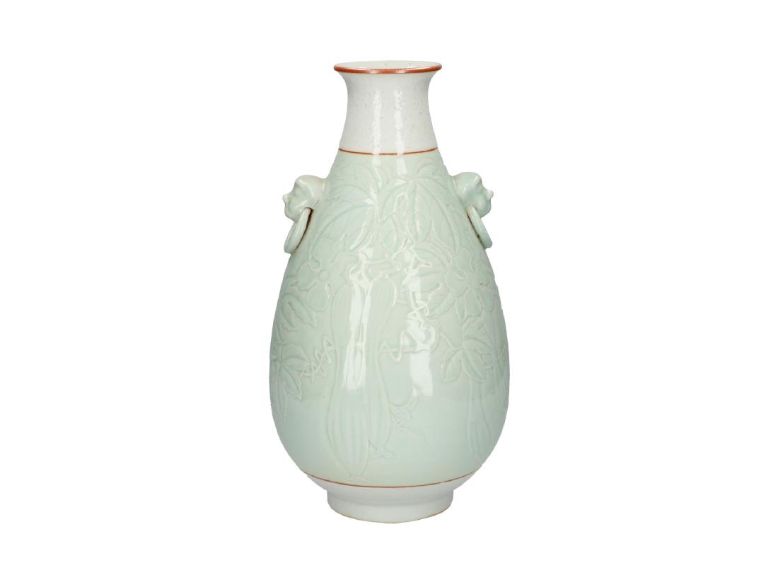 A celadon porcelain vase decorated with cucumbers. (1 of 5)