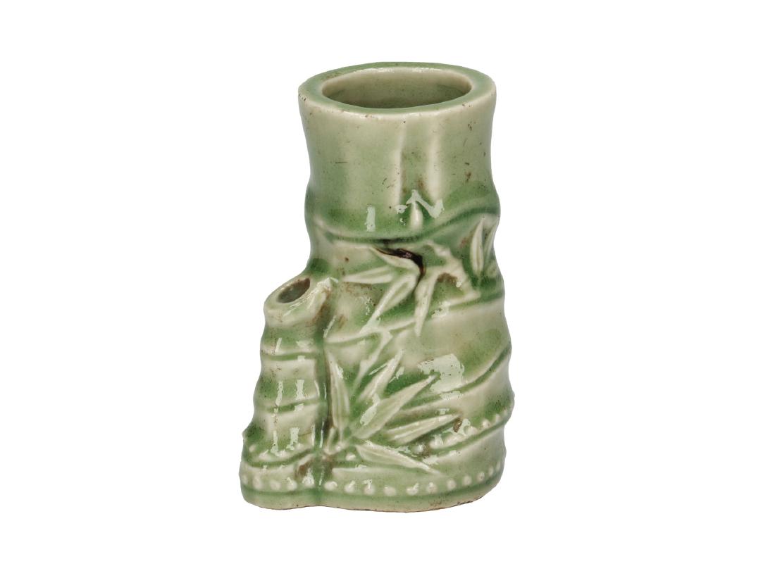 A green glazed ceramic brush pot, decorated with (1 of 5)