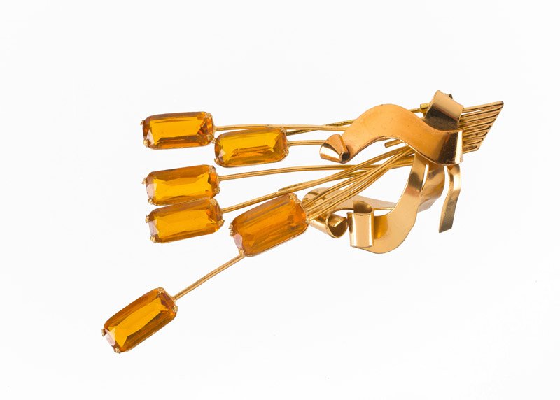 A Coro goldtone brooch, set with orange stones. Signed (1 of 3)