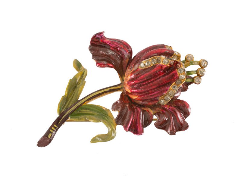 A Coro goldtone flower brooch, decorated with red and (1 of 3)