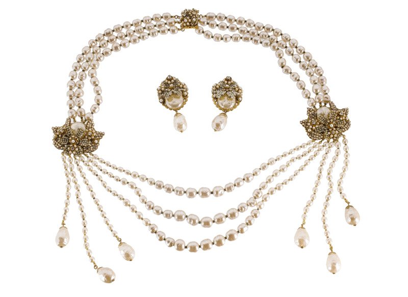 A DeMario faux pearl necklace and pair of earclips. Set (1 of 1)