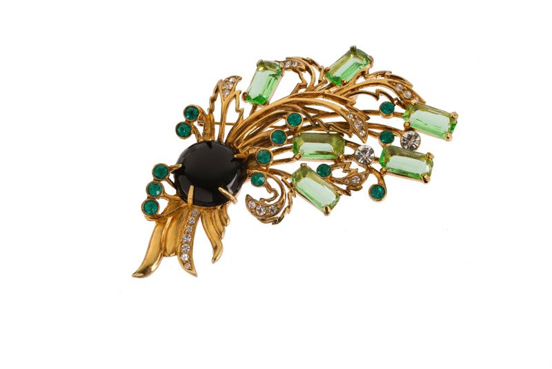 An Eisenberg goldtone floral brooch, set with black and (1 of 3)