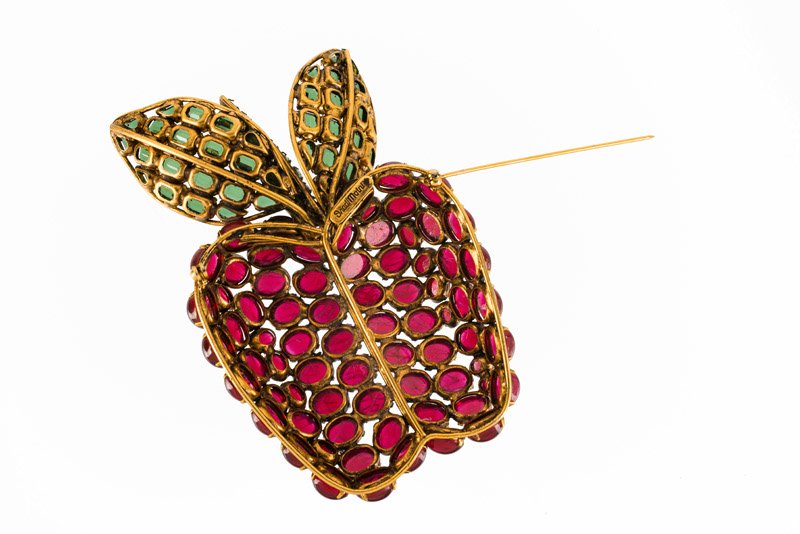 An Iradj Moini goldtone brooch in the shape of an (1 of 2)