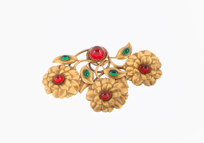 A Joseff Hollywood goldtone flower brooch, set with (1 of 2)
