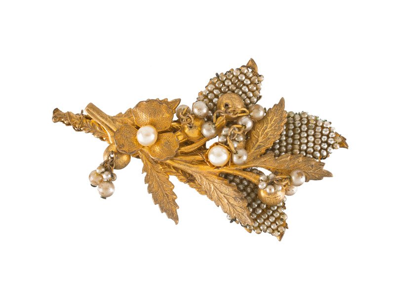 A Miriam Haskell faux pearl goldtone flower brooch. (1 of 3)