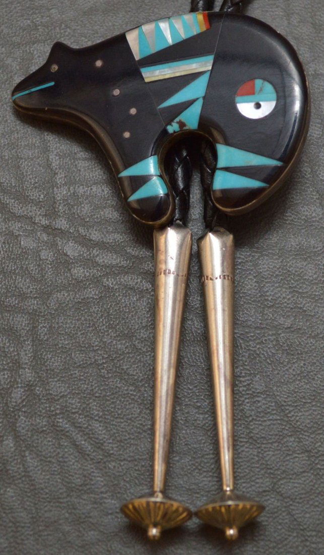 ZUNI SILVER BOLO: 1970-80's sterling silver with micro inlaid jet, turquoise, coral and abalone on bear figure. 2" x 1.5" Approximate weight: 1 oz Shipping for this lot: $10.00 (CONTINENTAL UNITED STATES ONLY) Unless n
