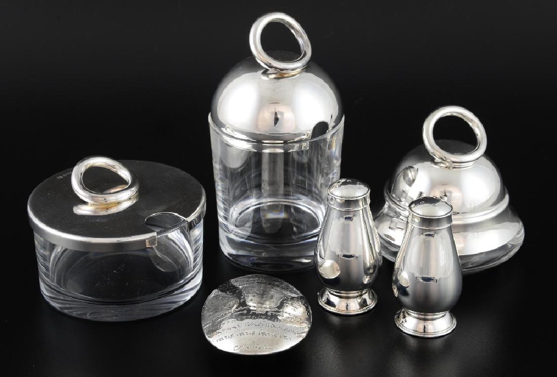 Collection of Christofle to include a glass butter dish: Collection of Christofle to include a glass butter dish with plated cover, jam jar and cover, a condiment pot and cover, a pair of salt and pepper shakers and a peace paperweight,