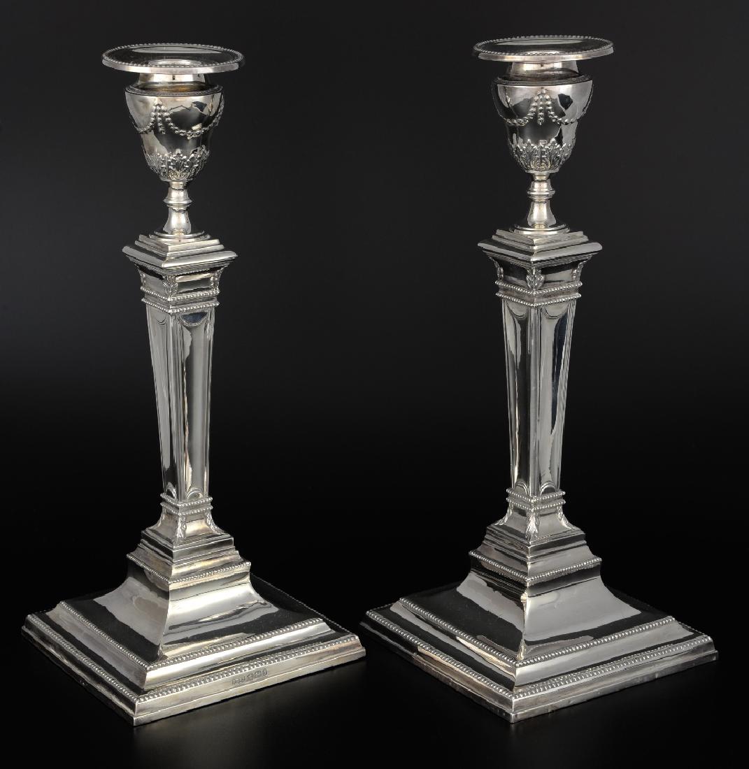 Pair of Victorian silver candlesticks with tapering: Pair of Victorian silver candlesticks with tapering columns on square beaded bases, by John Dixon & Sons Ltd., Sheffield, 1895/6 , loaded bases,