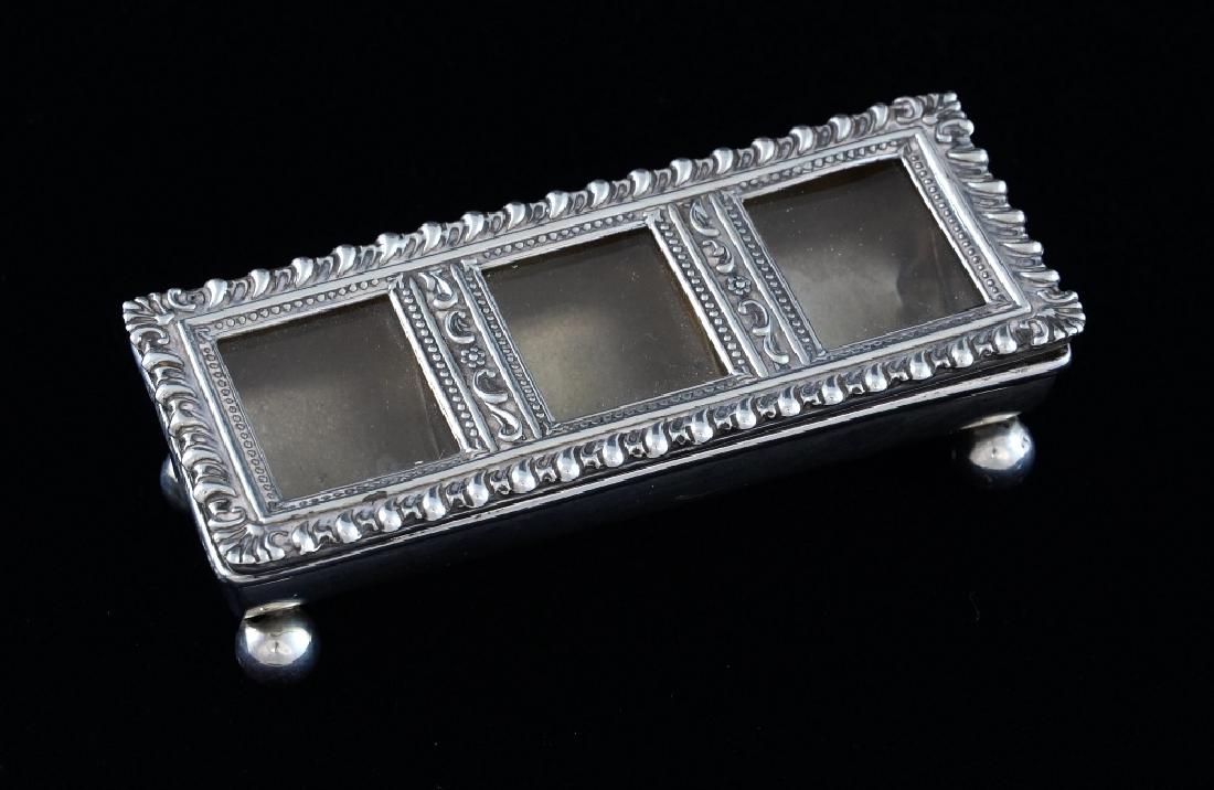 Edward VII silver three section stamp holder, the cover: Edward VII silver three section stamp holder, the cover with scroll decoration, on four ball feet, by William Harrison Walter, Birmingham, 1901,