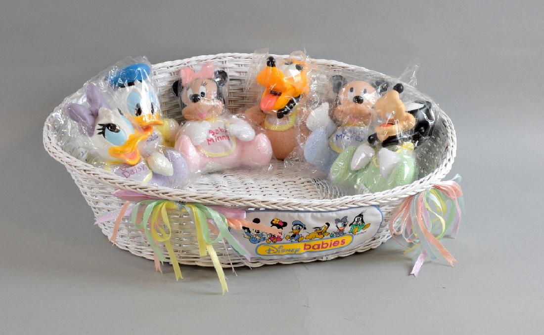 Six Ashton Drake Galleries dolls “Baby D: Six Ashton Drake Galleries dolls “Baby Donald” 96933, Baby Pluto 96934, Baby Daisy 96935, Baby Goofy 96936, Baby Mickey 96931, Baby Minnie 96932. a Disney basket and other dolls and figures