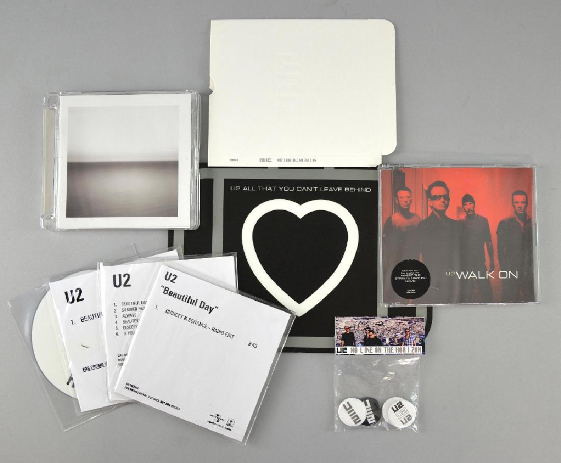 U2 - No Line On The Horizon CD album plu: U2 - No Line On The Horizon CD album plus slip case, band interview CD about album, pack of badges, All That You Can’t Leave Behind mousemat & album 6 track promo CDR, Beautiful Day Promo CDR & remi