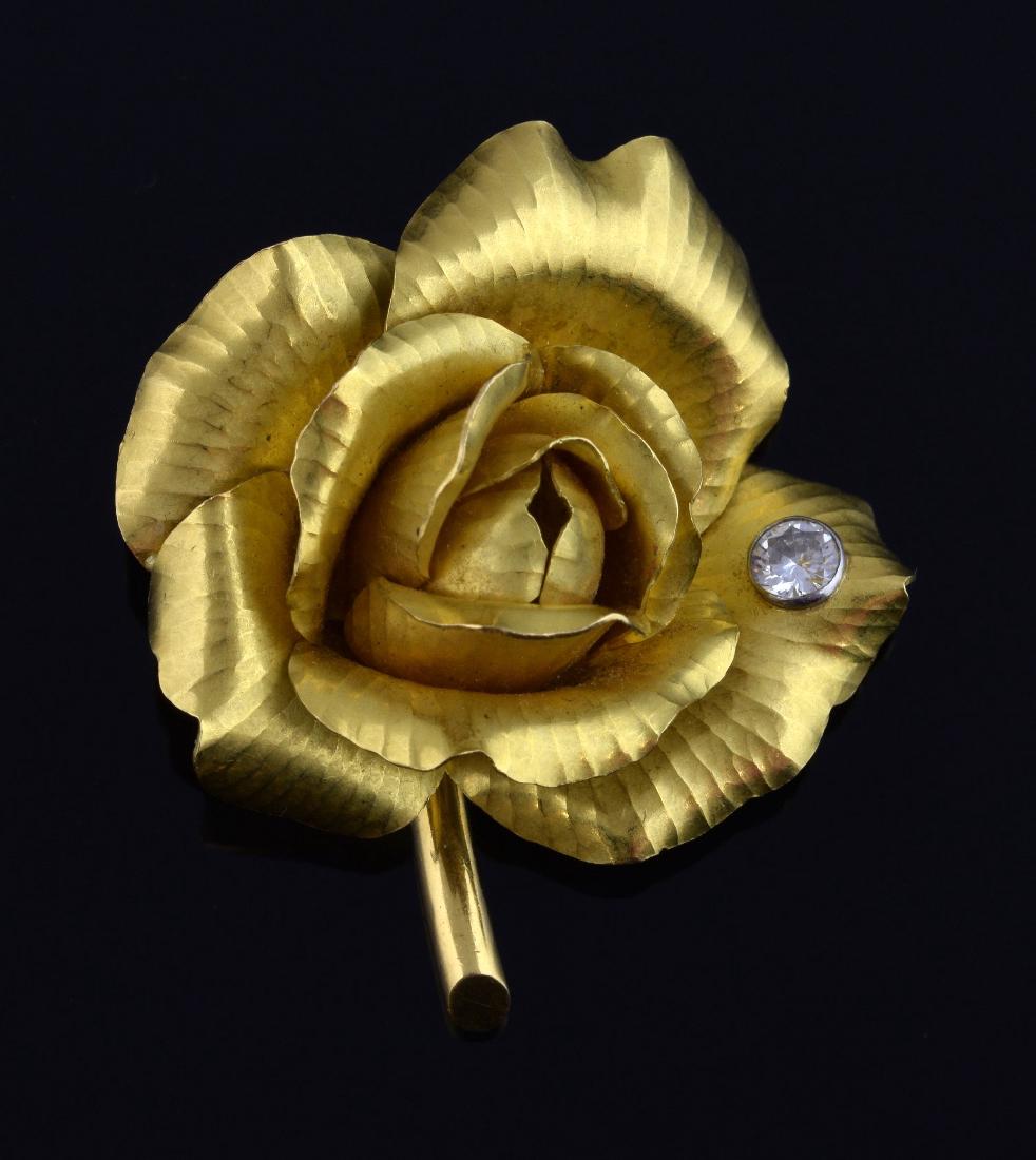 Cartier gold diamond set brooch in the form of a r (1 of 2)