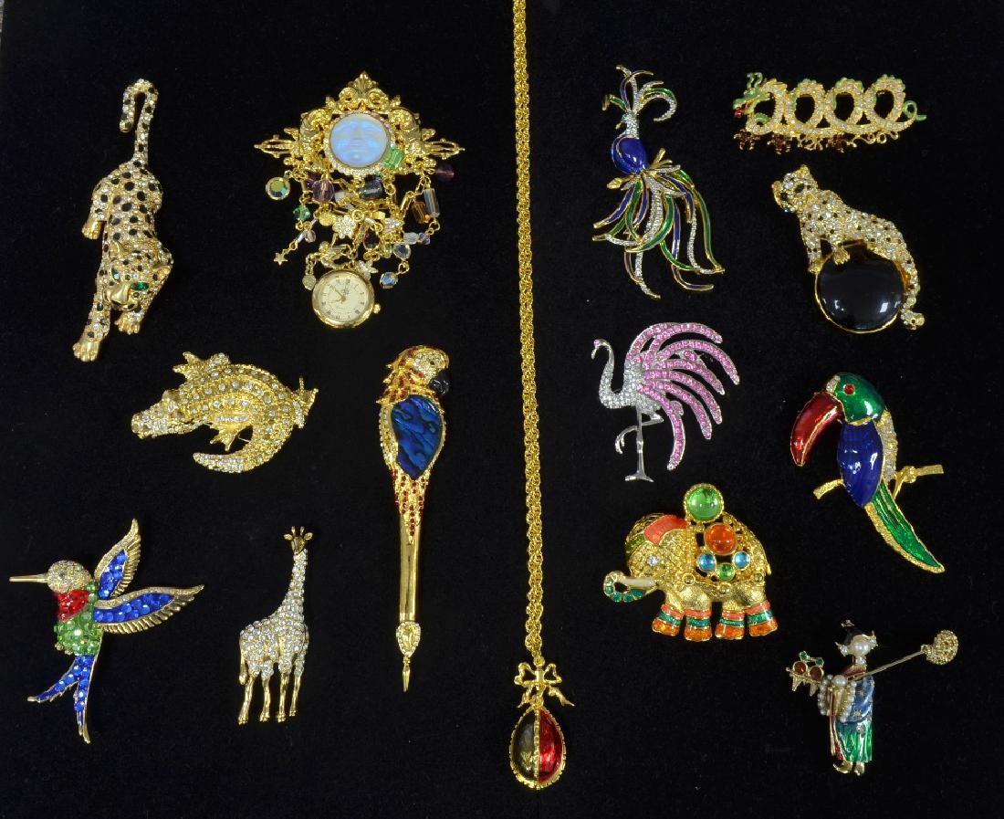Group of costume jewellery, figure by Butler and W: Group of costume jewellery, figure by Butler and Wilson, elephant by Shakira Caine, other named pieces mainly animals, and a man in the moon fob watch (14)