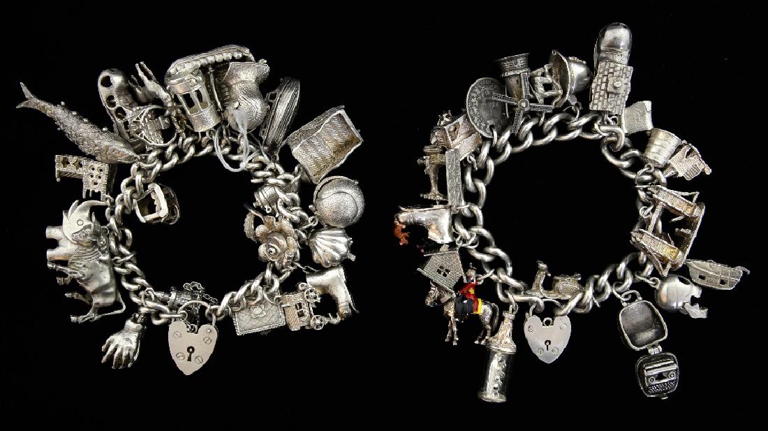 Two silver charm bracelets with numerous charms, i (1 of 1)