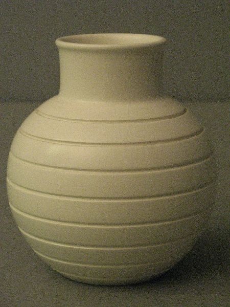 Keith Murray white pottery vase: Keith Murray white pottery vase with bulbous body and multiple horizontal grooves, transfer mark to base, 6" high,