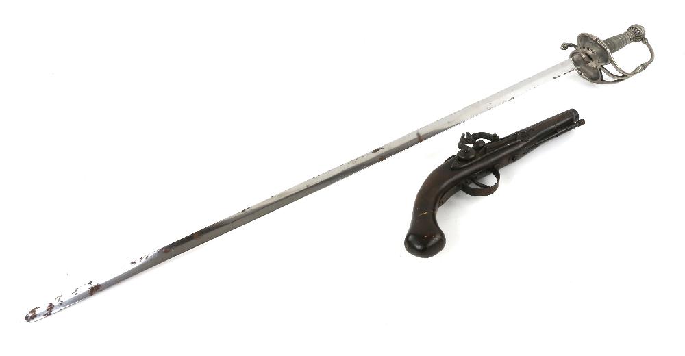 A prop sword and flintlock pistol similar to those: A prop sword and flintlock pistol similar to those used in Pirates of the Caribbean, the pistol of carved wood and cast metal, 14 inches long, the sword cast metal and decorative hilt, 38 1/2 inches l