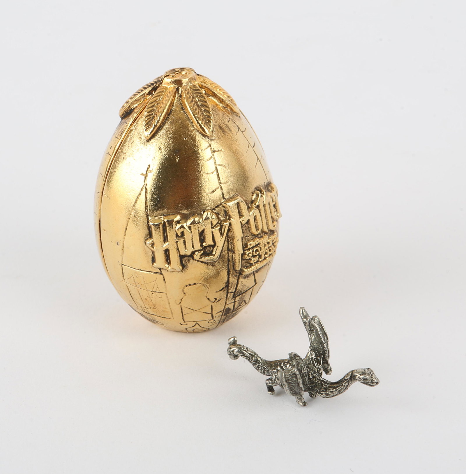 Harry Potter and the Goblet of Fire (2005) a golde: Harry Potter and the Goblet of Fire (2005) a golden Triwizard tournament egg with pewter Chinese Fireball dragon, promotional competition prize from Warner Brothers to mark the launch of the film, com