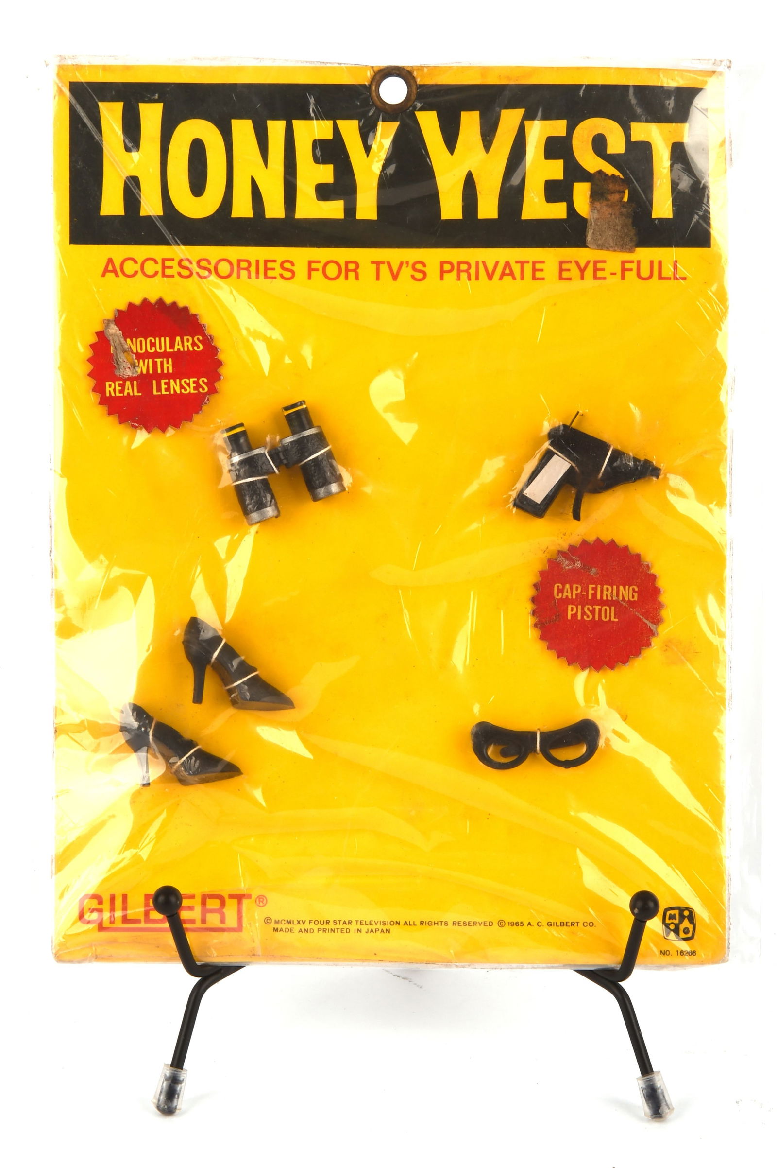Honey West - 1965 Gilbert HONEY WEST Doll Accessor: Honey West - 1965 Gilbert HONEY WEST Doll Accessories, to include binoculars, cap gun, a pair of heels and glasses; (1)?Accessories for TV?s Private Eye- Full! CR:- In new and un-used condition. Still