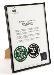 James Bond 007 – A View To A Kill (1985) – Framed: James Bond 007 – A View To A Kill (1985) – Framed prop Zorin label, with COA, 8.5 x 12 inches; (1) CR:- In very good condition, ready to hang.