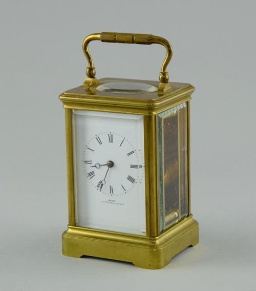 Brass carriage clock by Dent of London, bevelled glass