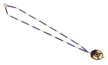 Antique enamel pansy pendant set with a central ga