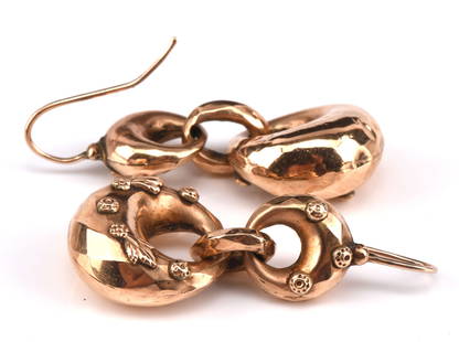 Victorian drop earrings, with faceting and foliate: Victorian drop earrings, with faceting and foliate decoration 40mm in length, and hook fastenings tested as 9 ct Gross weight 37.5 grams missing some detailing on one earring