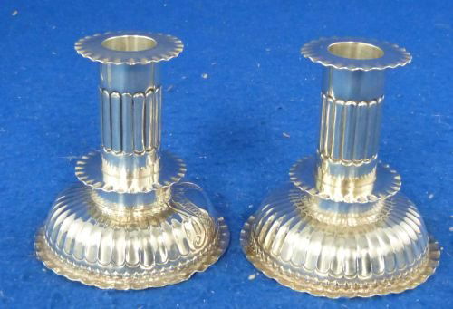 Pair of Victorian silver squat form candlesticks on cir: Pair of Victorian silver squat form candlesticks on circular bases, by Charles Stuart Harris London 1886, (loaded)