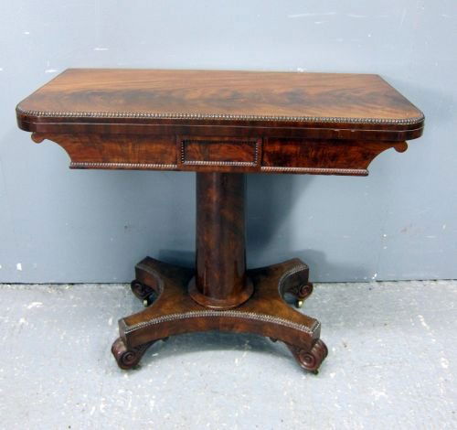 Victorian mahogany folding card table on round column s: Victorian mahogany folding card table on round column support and shaped platform base with scroll feet