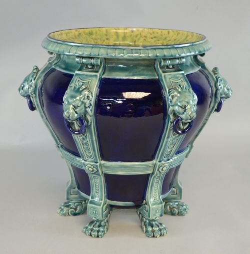 Minton Majolica jardiniere with lion mask handles and: Minton Majolica jardiniere with lion mask handles and paw feet coloured in aquamarine against a deep blue ground, impressed mark and year cipher for 1885, 35.5cm high