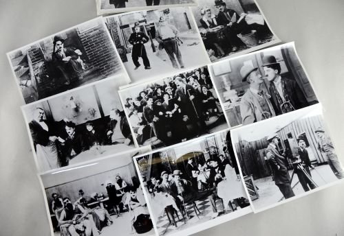 A Quantity of 10 x 8 film stills of Charlie Chaplin: A Quantity of 10 x 8 film stills of Charlie Chaplin including Work, Easy Street, A Dog's Life, Dough & Dynamite, Night Out and others (24)