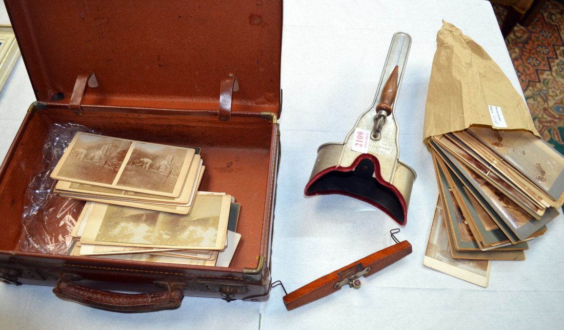 Stereoscope viewer and slides in a leather suit case: Stereoscope viewer and slides in a leather suit case