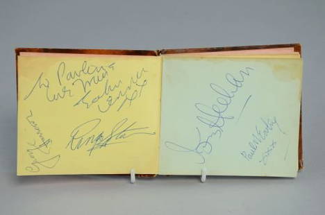 The Beatles, Autograph book signed in blue ink by all: The Beatles, Autograph book signed in blue ink by all four, John Lennon, Paul McCartney, George Harrison and Ringo Starr, and another signature of Tony Meehan of The Shadows, dedicated to Pauline in J