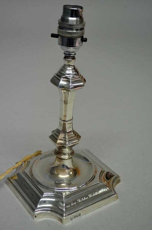 George V silver candlestick with fluted and knopped: George V silver candlestick with fluted and knopped stem on shaped square base, by Hawksworth, Eyre & Co Ltd., Sheffield, 1927, (converted to a lamp), 10in. (25cm)