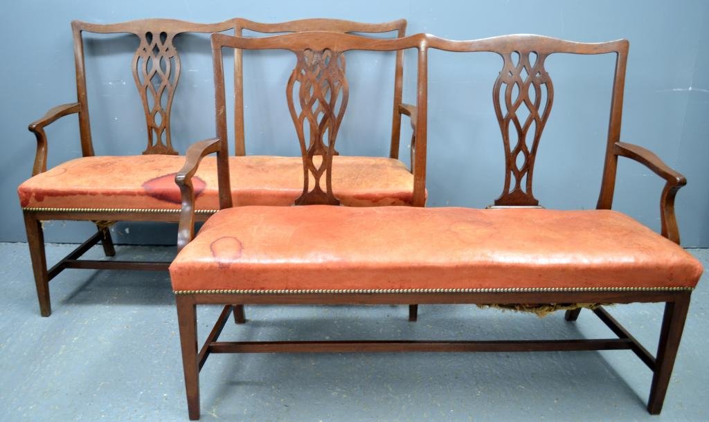 Pair of 19th century mahogany and leather upholstered: Pair of 19th century mahogany and leather upholstered double back settees in the Chippendale manner