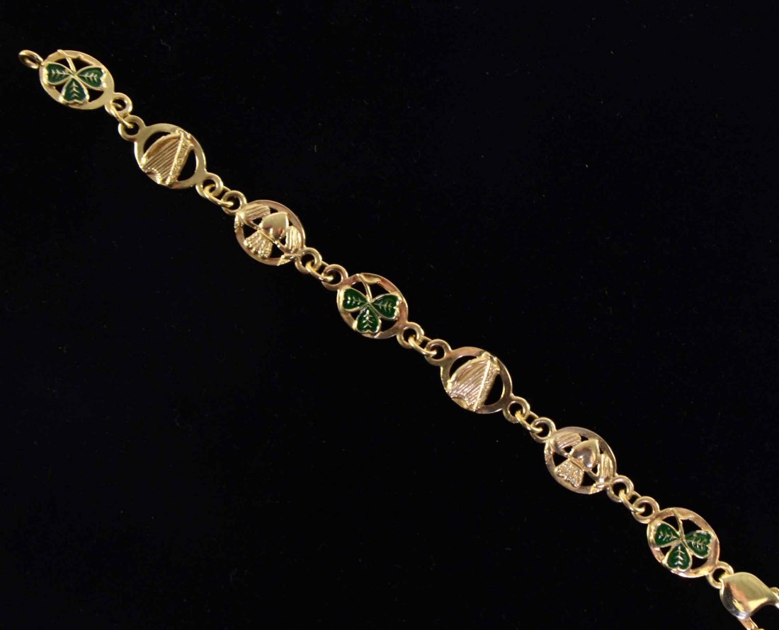 Irish theme gold bracelet with harps, enamelled: Irish theme gold bracelet with harps, enamelled shamrock and claddagh symbols, 9ct 20 grams, cased