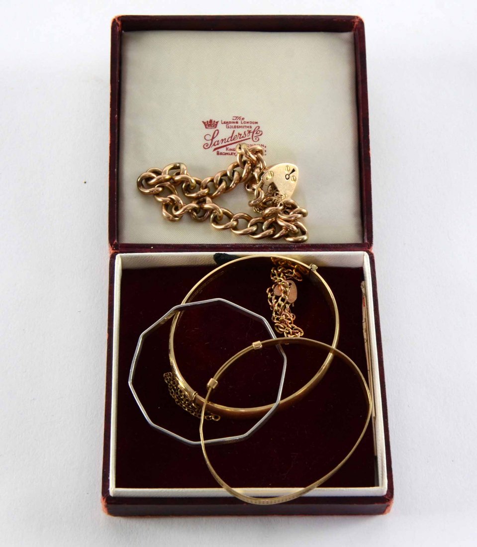 Two gold chain bracelets with heart clasps two gold: Two gold chain bracelets with heart clasps two gold plated and one silver bangle 23 grams gold weight