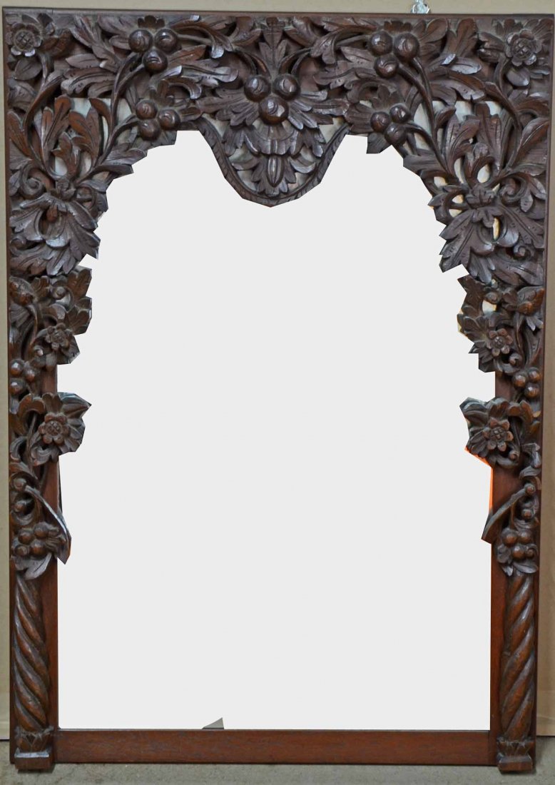 Late 19th early 20th century Indonesian carved hardwood: Late 19th early 20th century Indonesian carved hardwood mirror of arch form