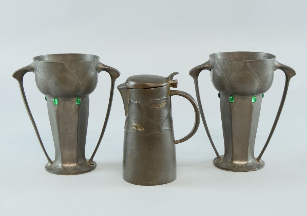Archibald Knox for Liberty & Co., covered jug stamped: Archibald Knox for Liberty & Co., covered jug stamped Tudric and a pair of pewter twin handled vases with oval cabouchons jug stamped 0278 , 14 cm, vases 17 cm