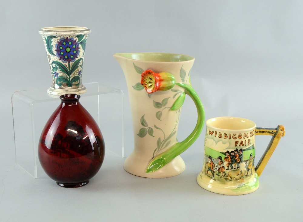 Art Deco ceramics including a Doulton flambe vase,: Art Deco ceramics including a Doulton flambe vase, Clarice Cliff jug , Crown Devon musical tankard and a Wedgwood lustre vase