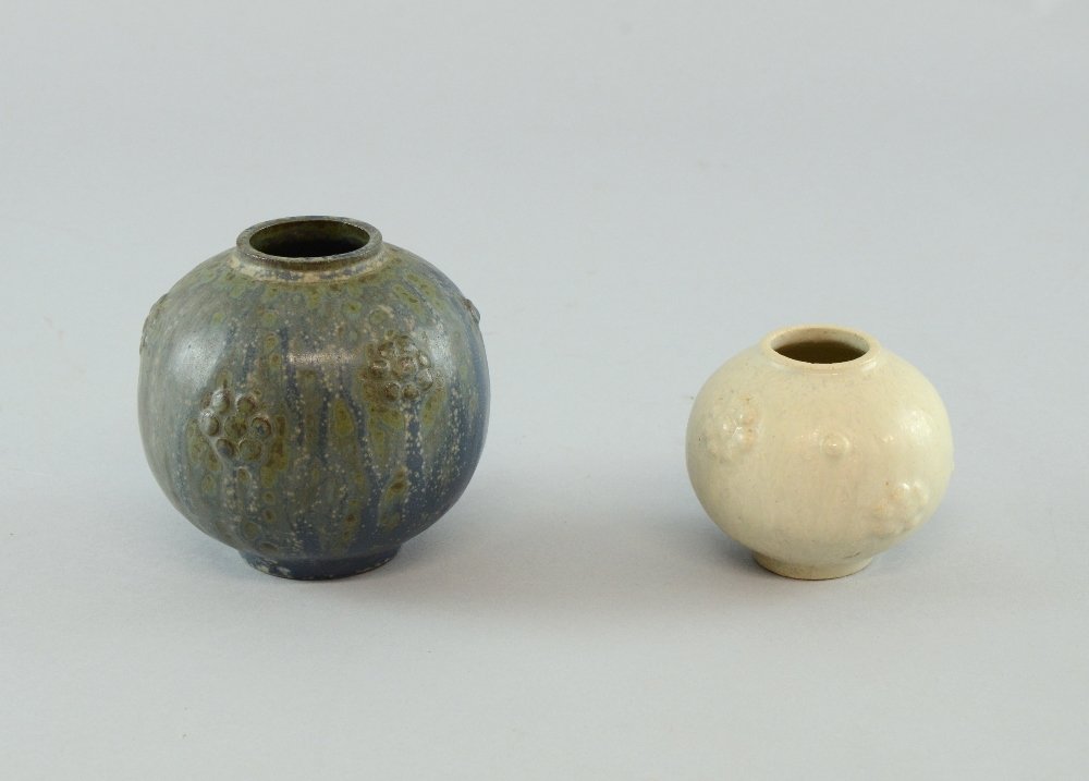 1930's Arne Bang studio pottery, two spherical vases: 1930's Arne Bang studio pottery, two spherical vases with raised flower heads blue drip glaze over green, incised monogram and 2/2 and cream with painted monogram. Arne Bang 1901-1983 Born in Demark h
