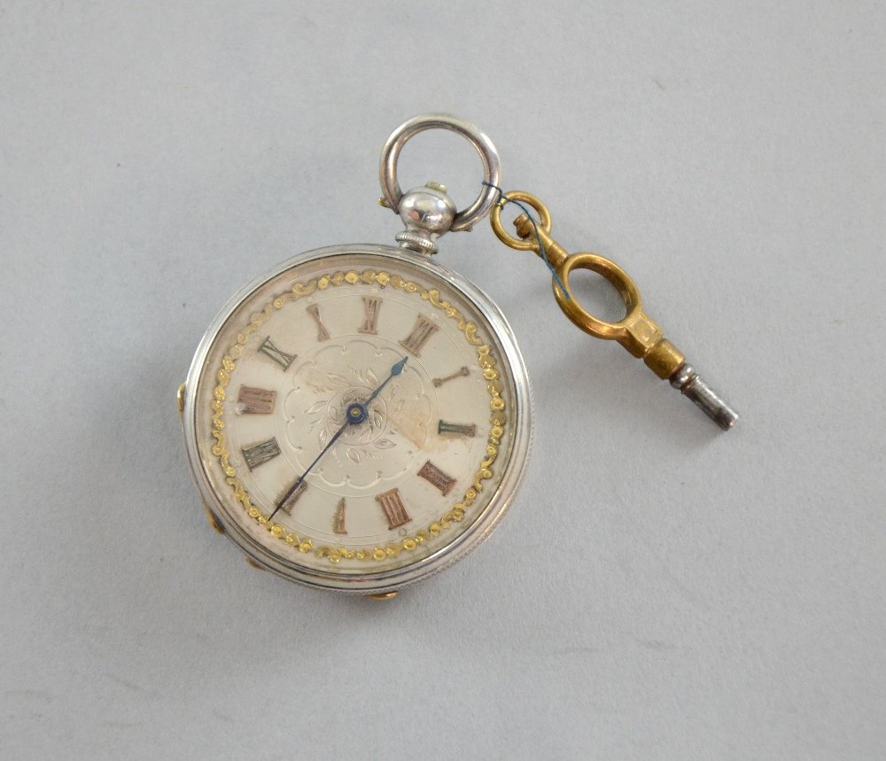 19th century American ladies pocket watch the engraved: 19th century American ladies pocket watch the engraved dial inlaid with yellow metal, the case stamped fine silver Diameter 1.5"