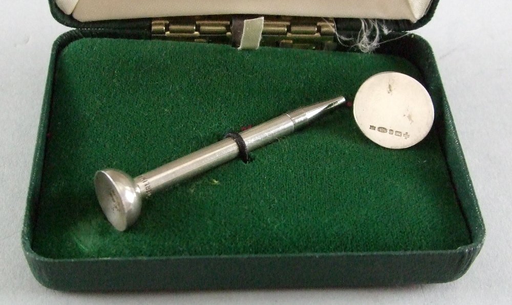 Modern silver golf tee pencil and ball marker set,: Modern silver golf tee pencil and ball marker set, Birmingham, 2000, (in fitted case),