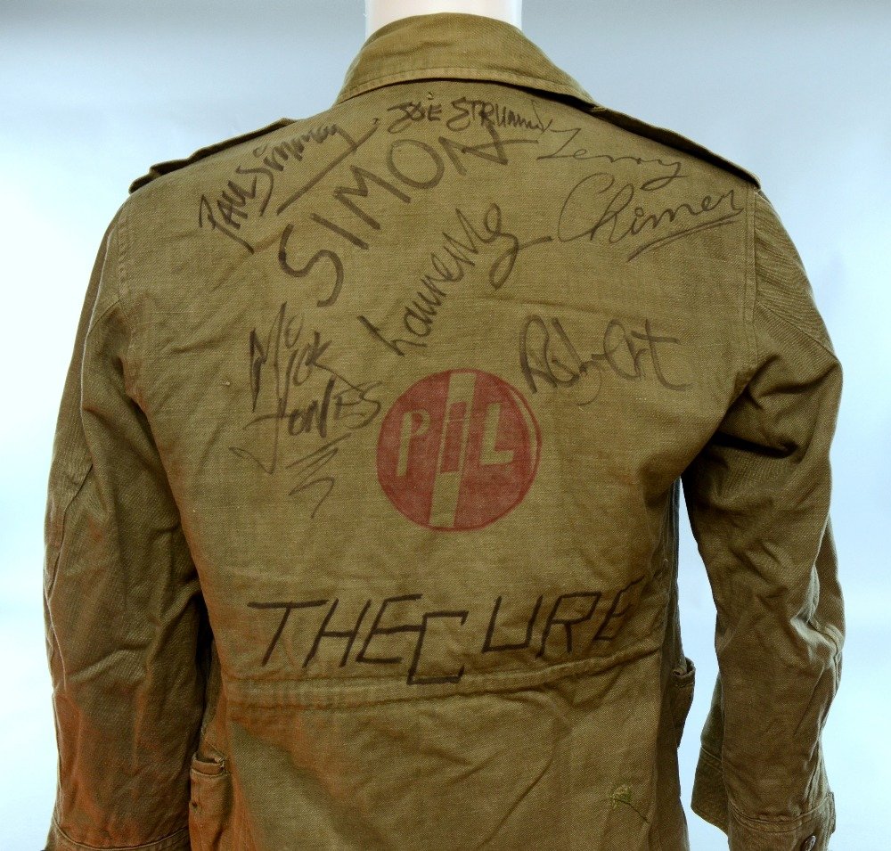 Music: A jacket signed by members of The Clash & The: Music: A jacket signed by members of The Clash & The Cure including Joe Strummer, Mick Jones, Paul Simonon, Terry Chimes, Robert Smith 'Robert', Lol Tolhurst 'Laurence' & Simon Gallup 'Simon', signed