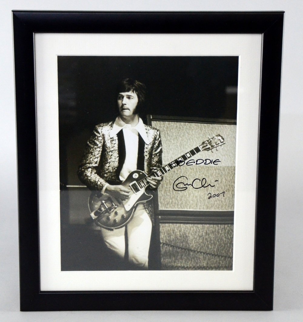 Eric Clapton, a signed black and white photograph,: Eric Clapton, a signed black and white photograph, signed 'To Eddie Eric Clapton 2007' in black felt tip, framed 10 x 8in. (25 x 20cm)